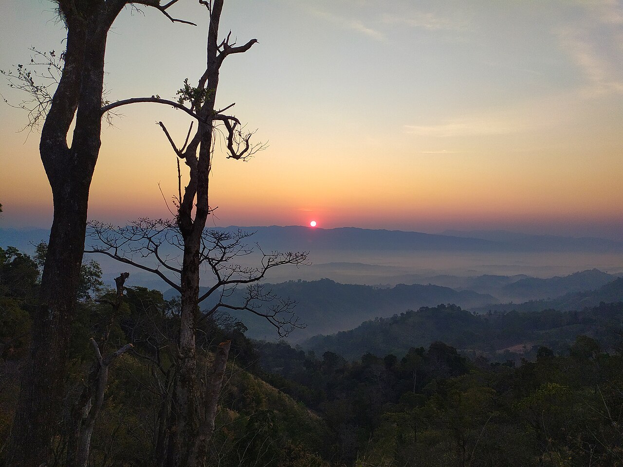 Sunrise over cloud-filled valleys at Sajek